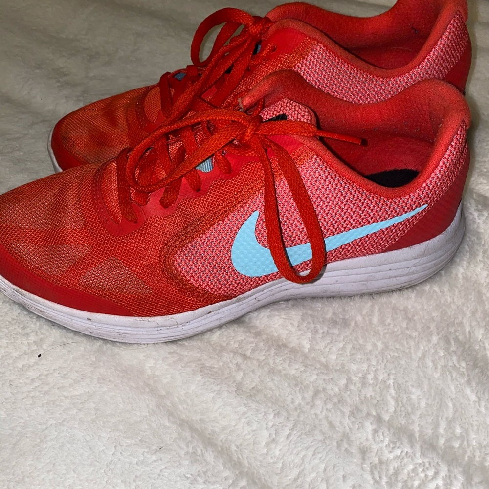 Coral Nike running shoes